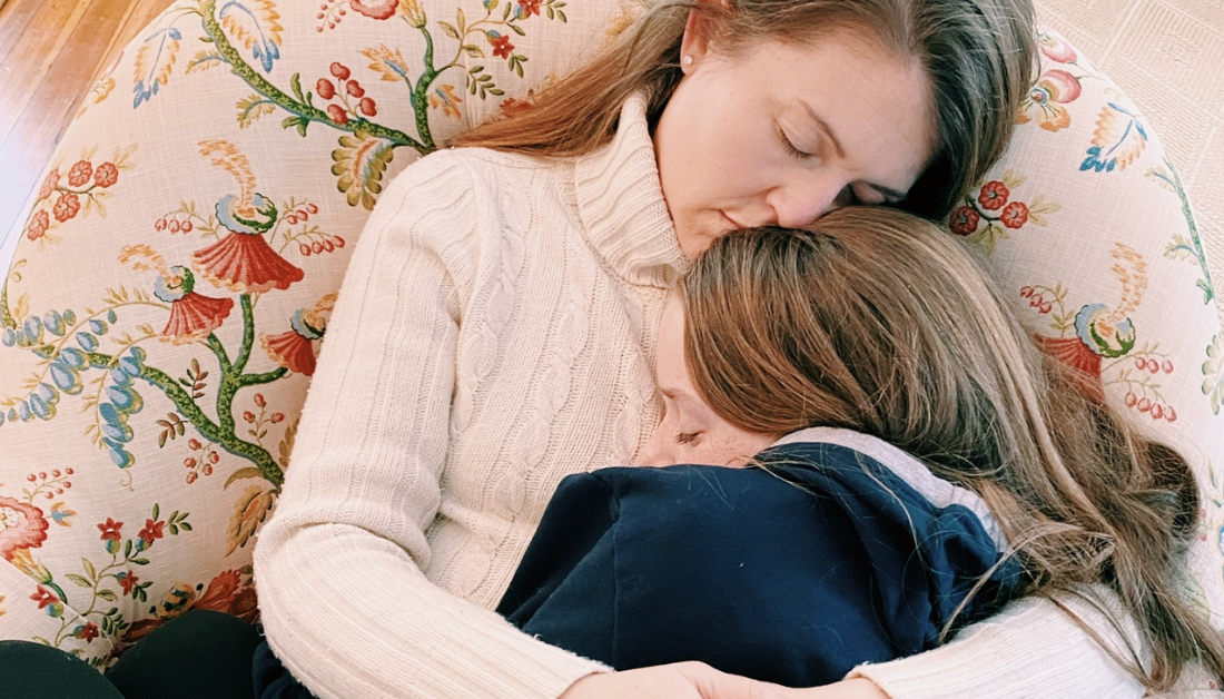 mother holding her daughter