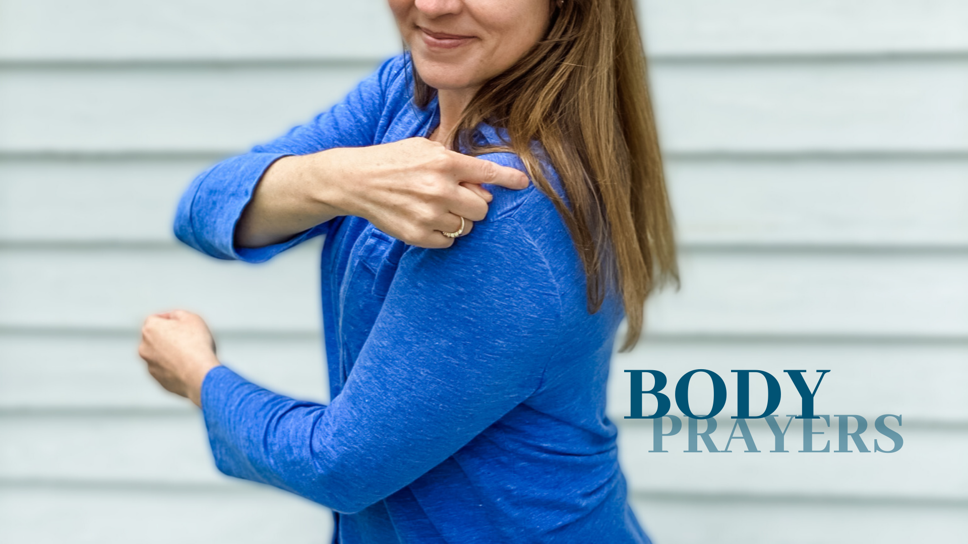 picture of Amy Julia pointing to her back while turned sideways with Body Prayers written as text overlay