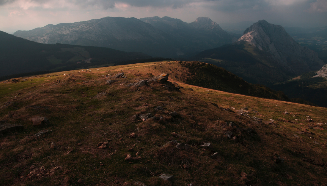 picture of dark mountain and clouds in the distance