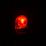 picture of a black background with a red flashing light