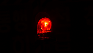 picture of a black background with a red flashing light
