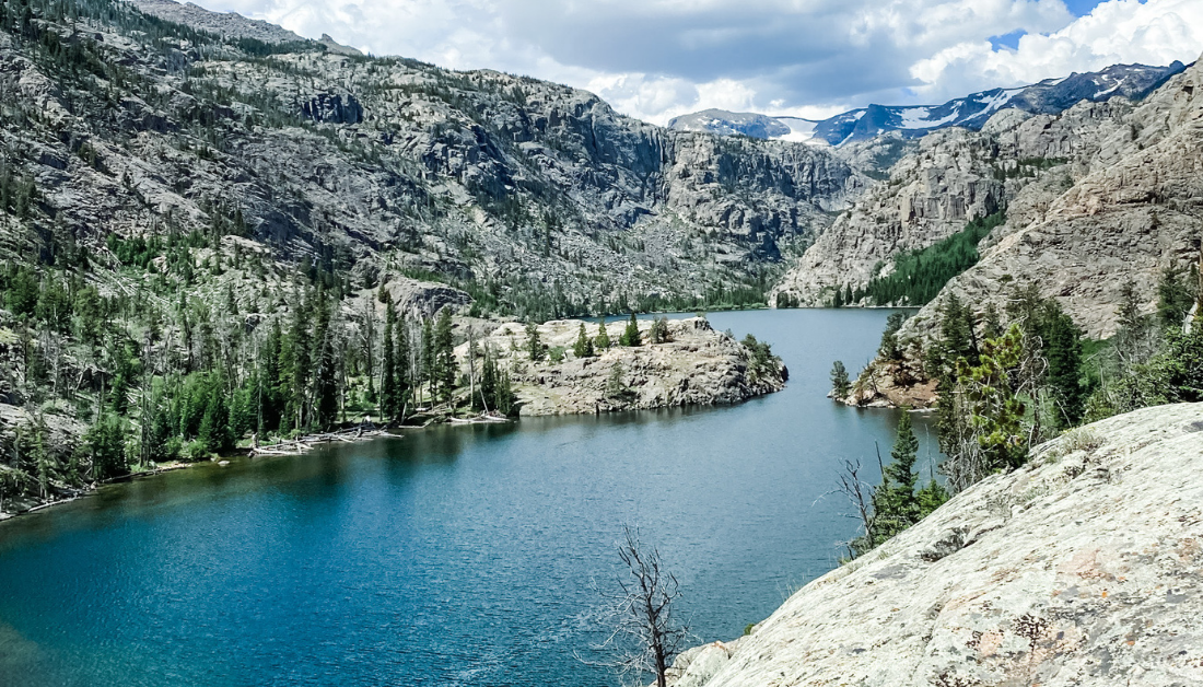 picture from vacation of mountains and a lake that reminds me that God is not tired of me