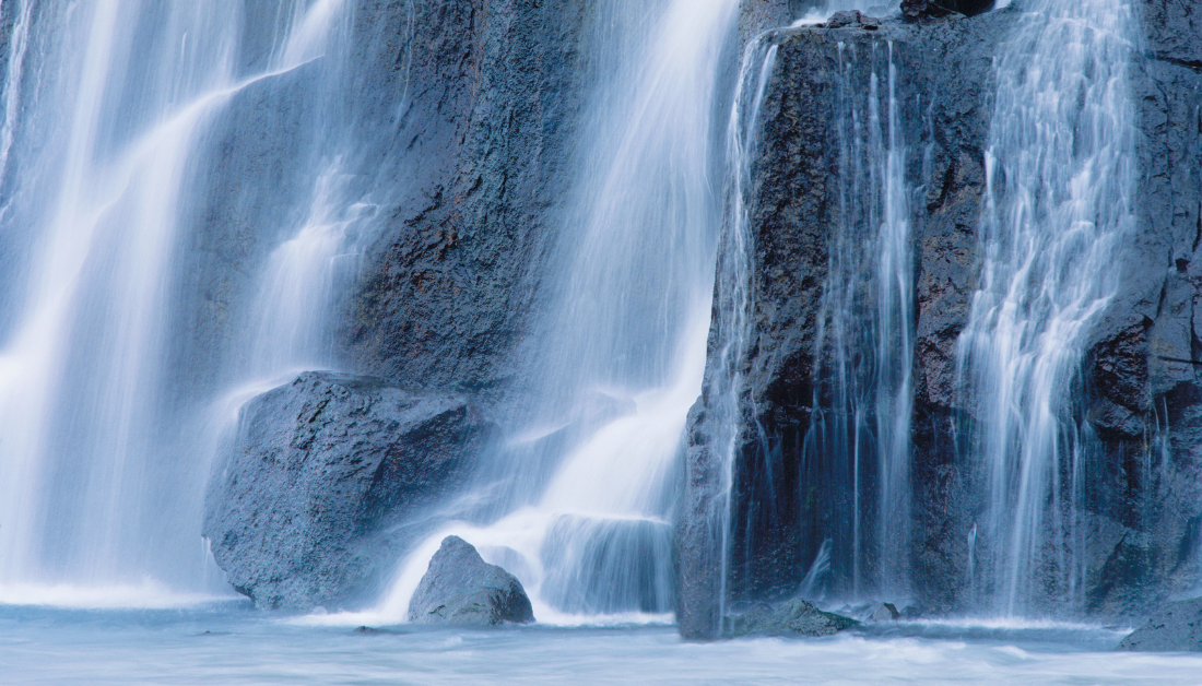 waterfall flowing into a pool below