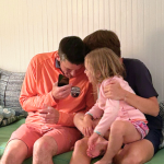 Peter, William, and a young cousin huddle together playing the name game