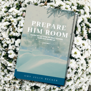 the advent devotional book Prepare Him Room resting on top of white mums