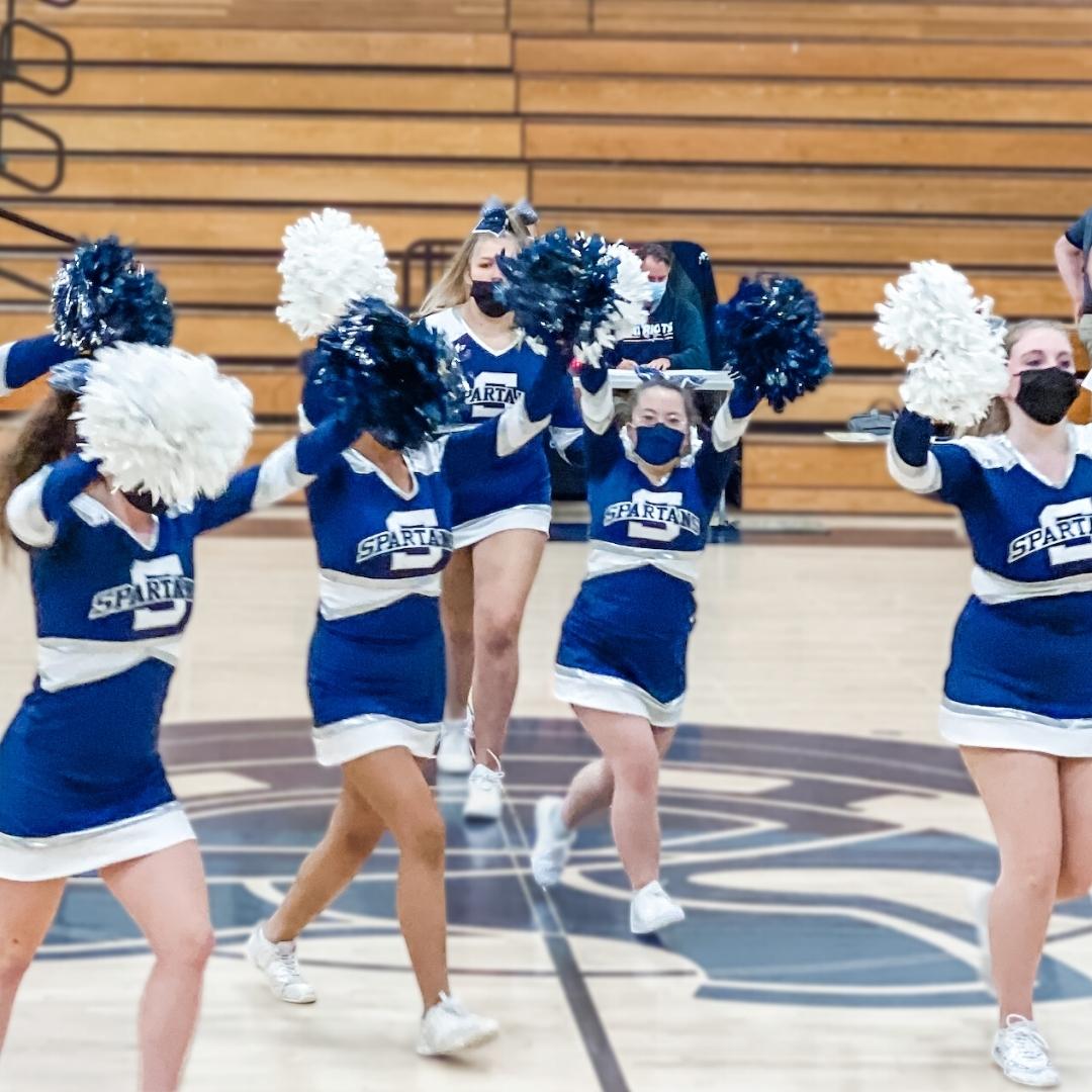 Penny on the basketball court with her cheerleading team