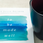 To Be Made Well book sits on a counter next to a mug of coffee