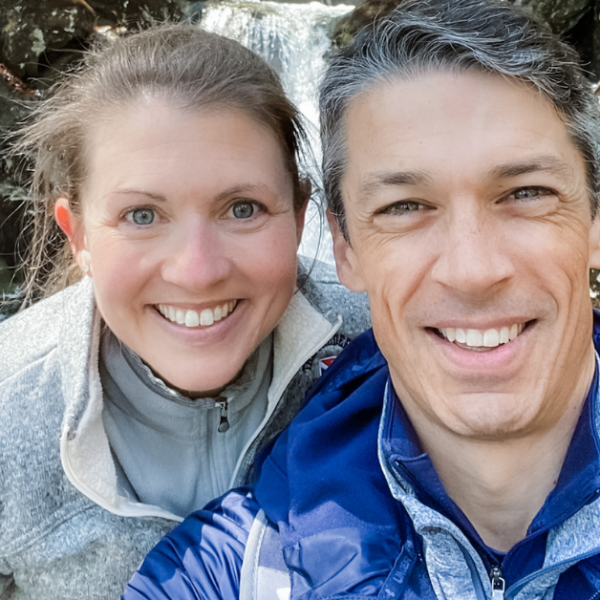 Amy Julia and Peter take a selfie in front of a waterfall