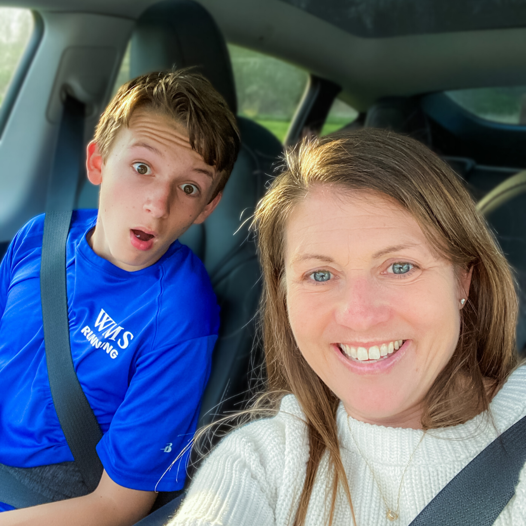 William and Amy Julia sit in a vehicle and pose for a selfie