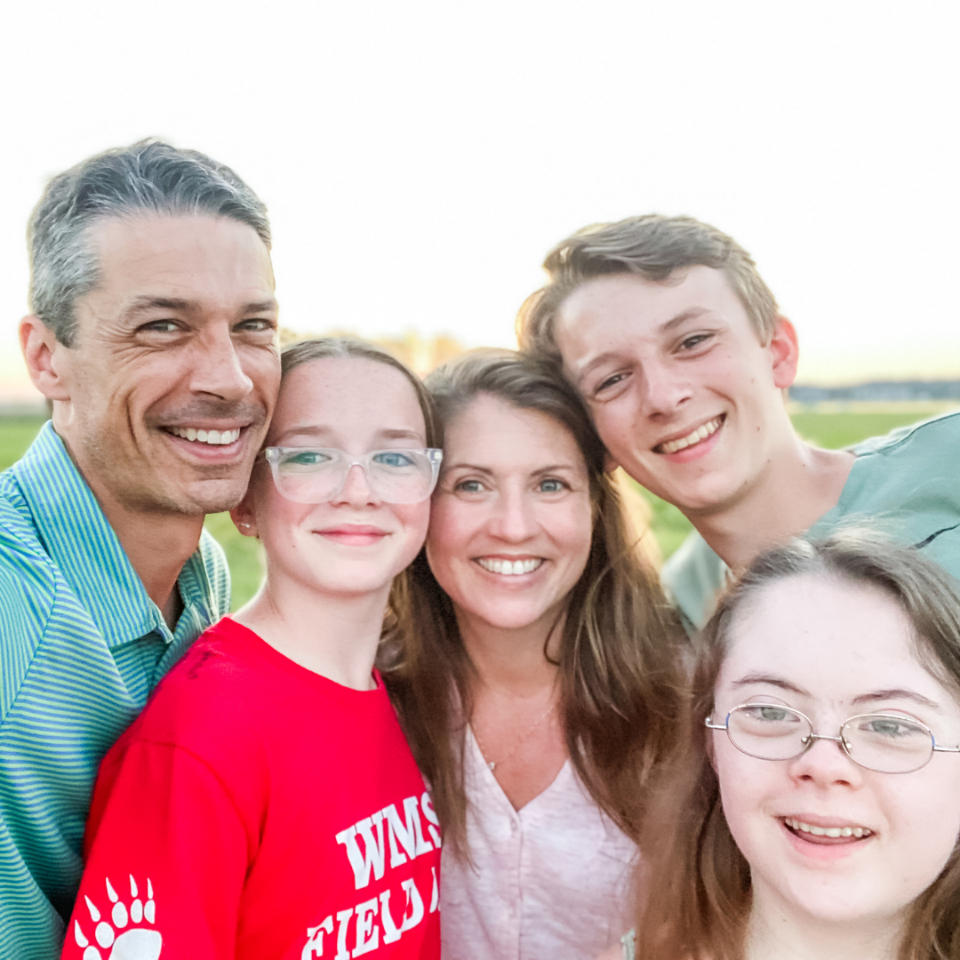Peter, Marilee, Amy Julia, William, and Penny smile at the camera for a selfie