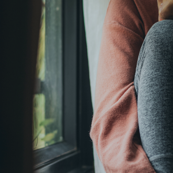 woman sitting by a window