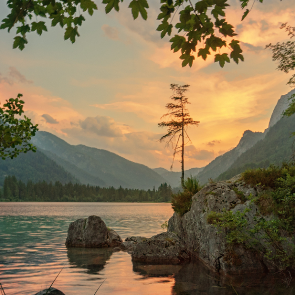 rocky lake landscape with setting sun