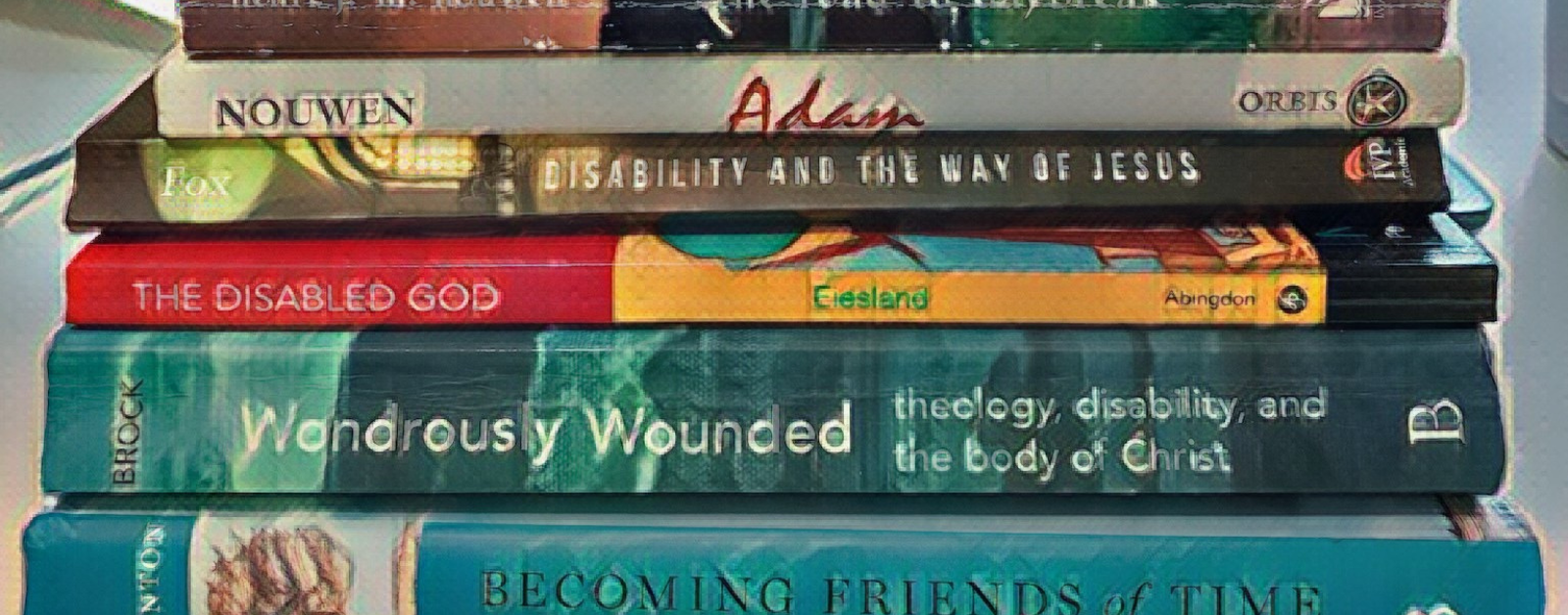 painted filter over a photo of a stack of books about disability