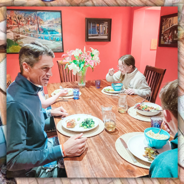 mosaic background behind a photo of Amy Julia's family eating dinner together