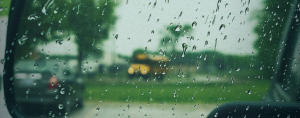 photo of a school bus seen through a rain-covered window