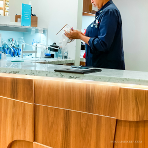 photo of an optometrist cleaning glasses