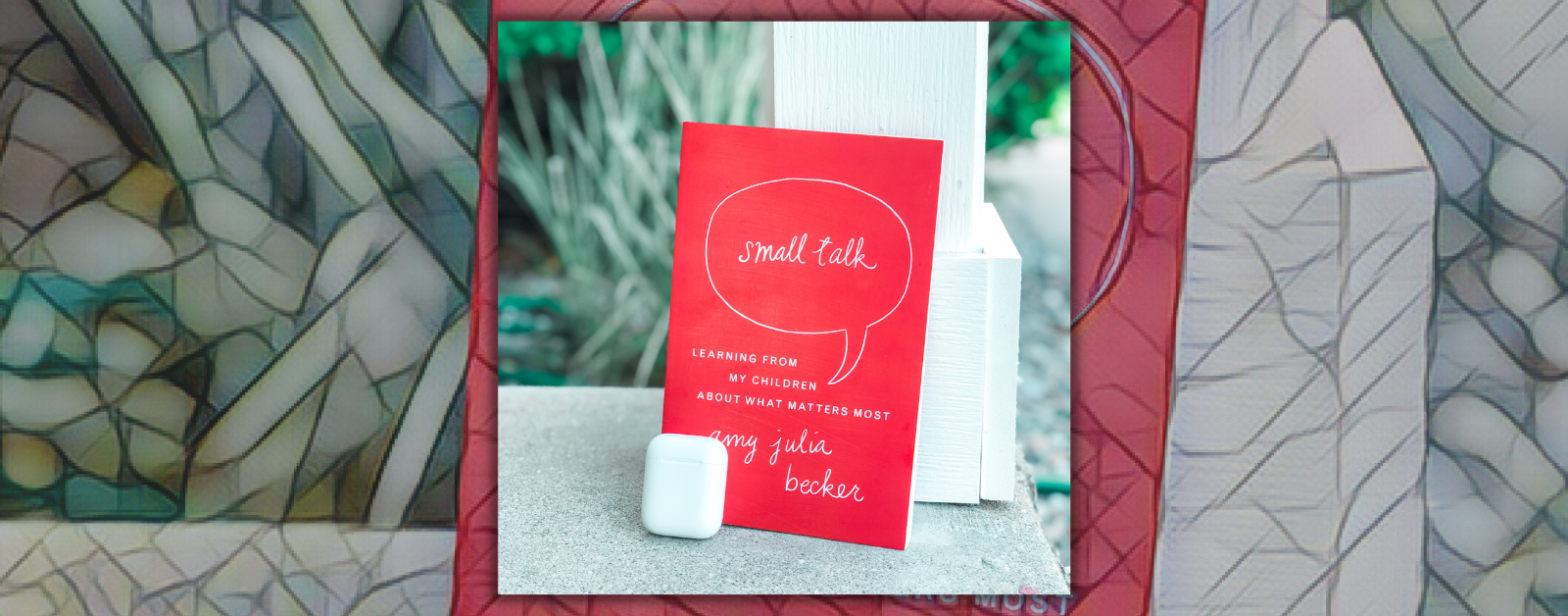 photo of the book Small Talk leaning against a white post with airpods next to it