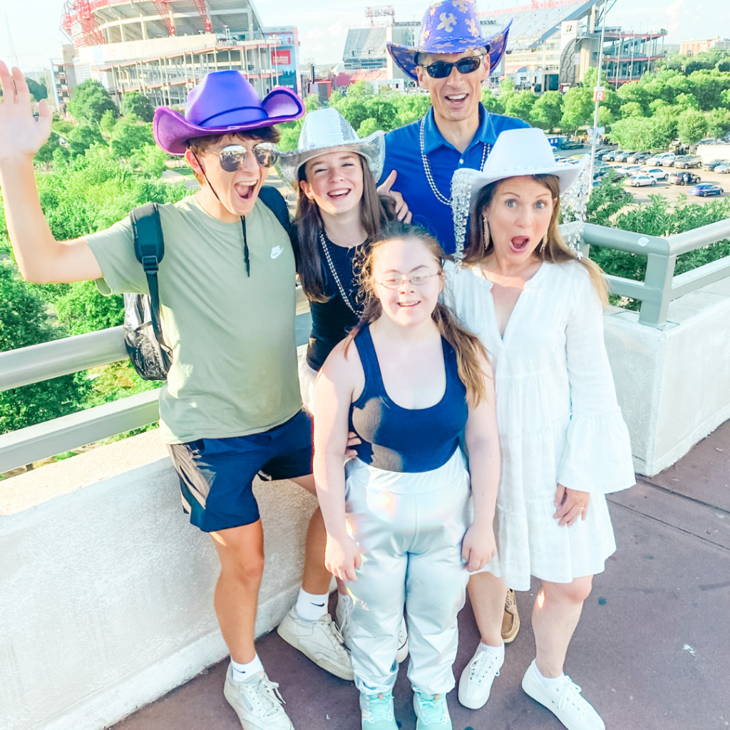 Amy Julia's family makes silly faces on a bridge in Nashville