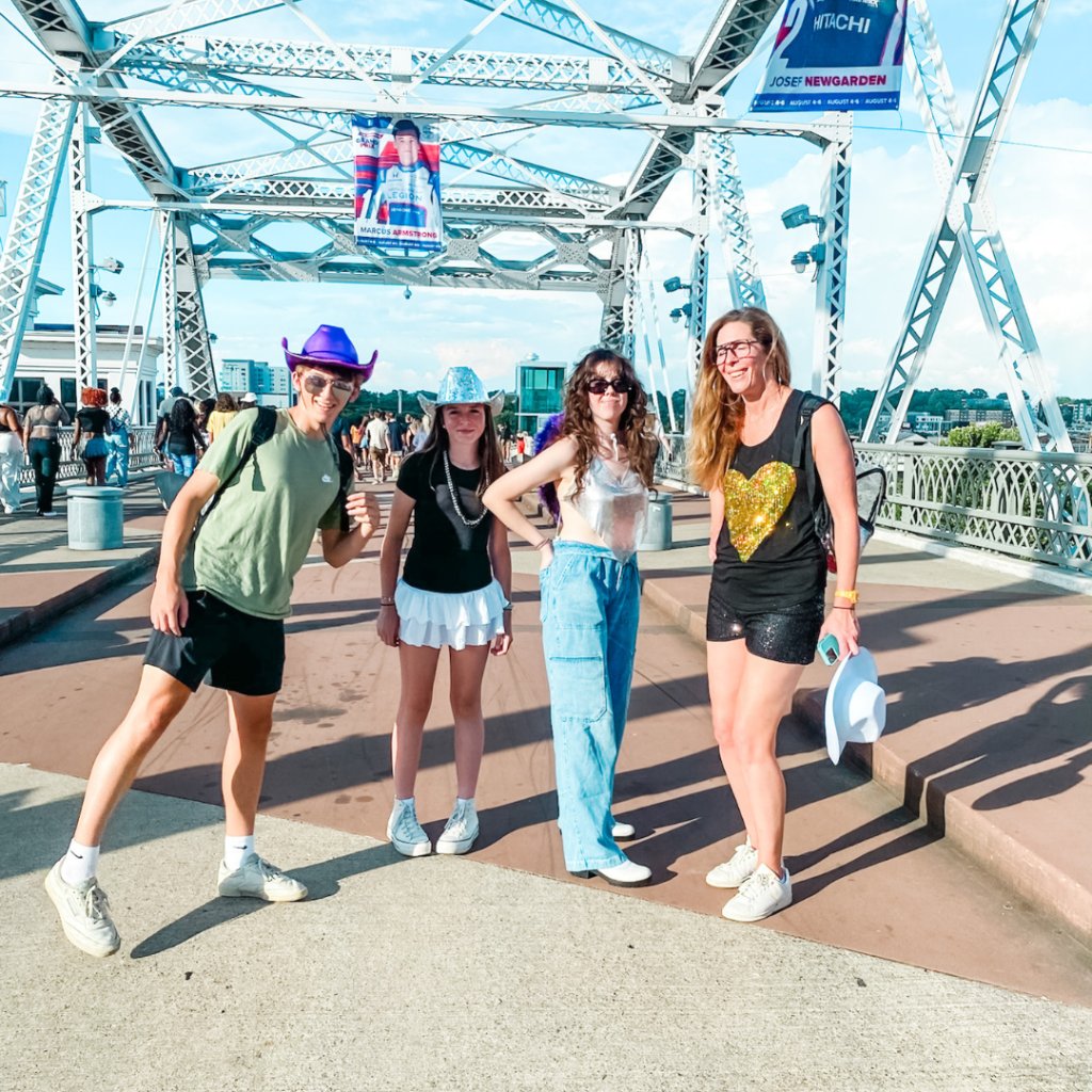 William, Marilee, and two friends pose on a bridge in Nashville