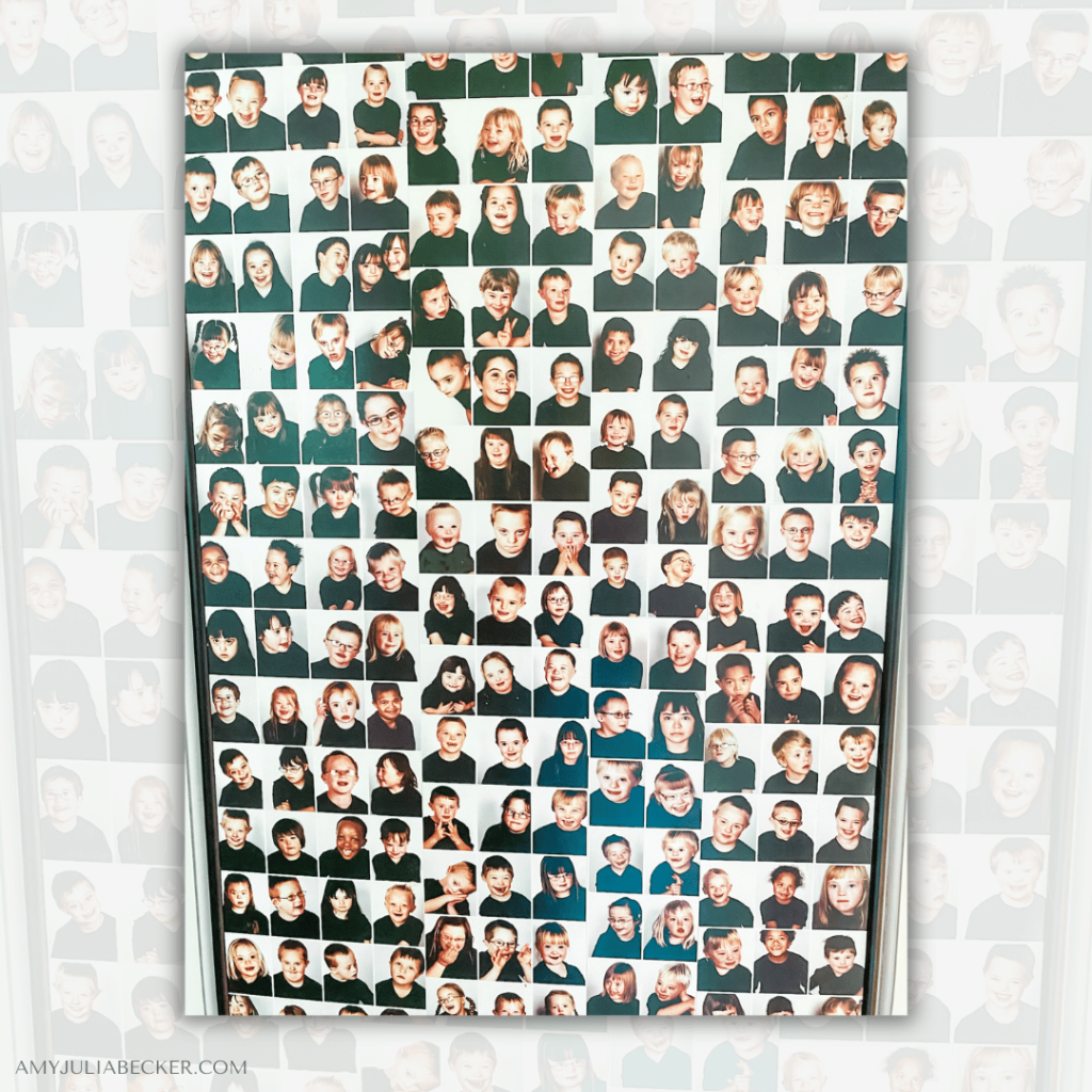 photo of a poster with hundreds of faces of people dressed in a black tshirt, photographed from the waist up. Their clothing and posture was the same. They all had Down syndrome.