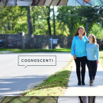 photo of Amy Julia and Penny walking down a sidewalk with the Cognoscenti logo