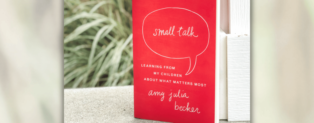 photo of the book Small Talk next to a white pillar on a porch with blurred grasses in the background