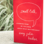 photo of the book Small Talk next to a white pillar on a porch with blurred grasses in the background