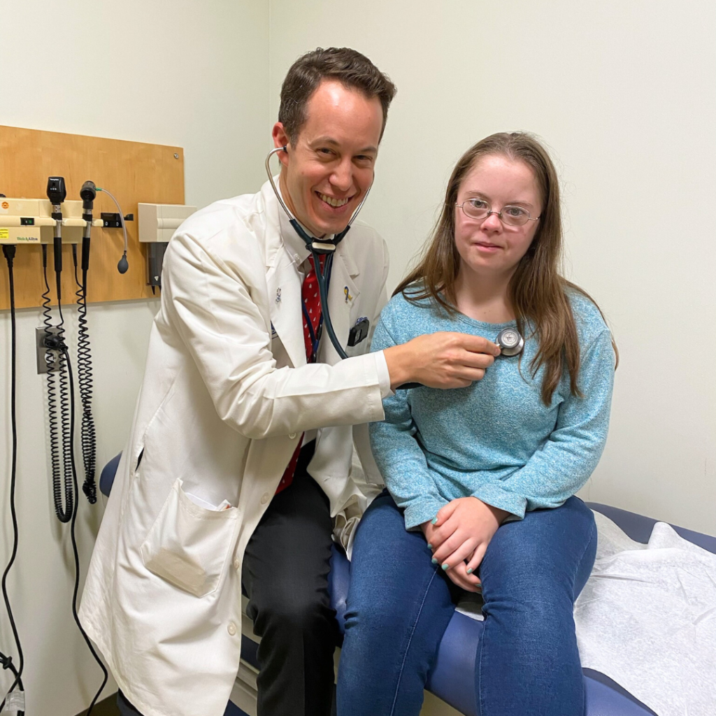 photo of Dr. Skotko and Penny at Mass General Down syndrome clinic