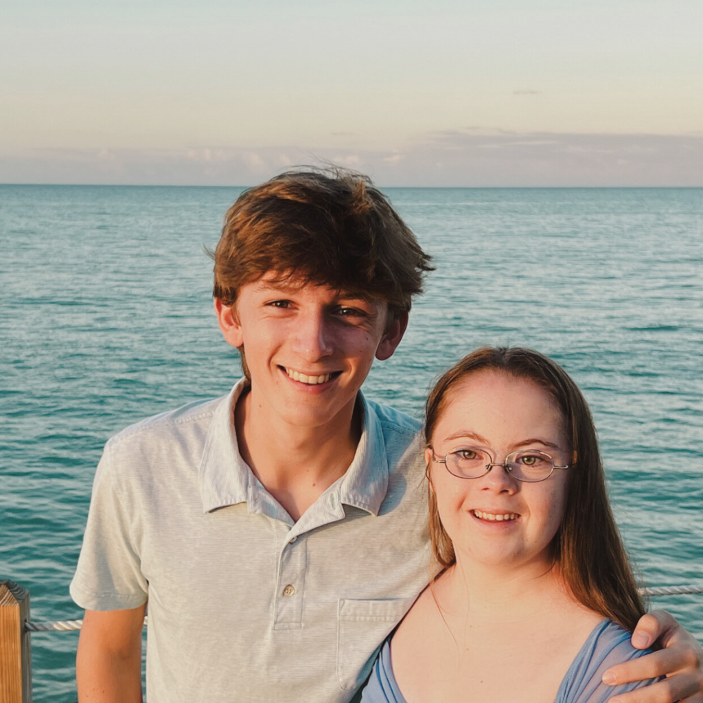 William and Penny standing together in front of the ocean