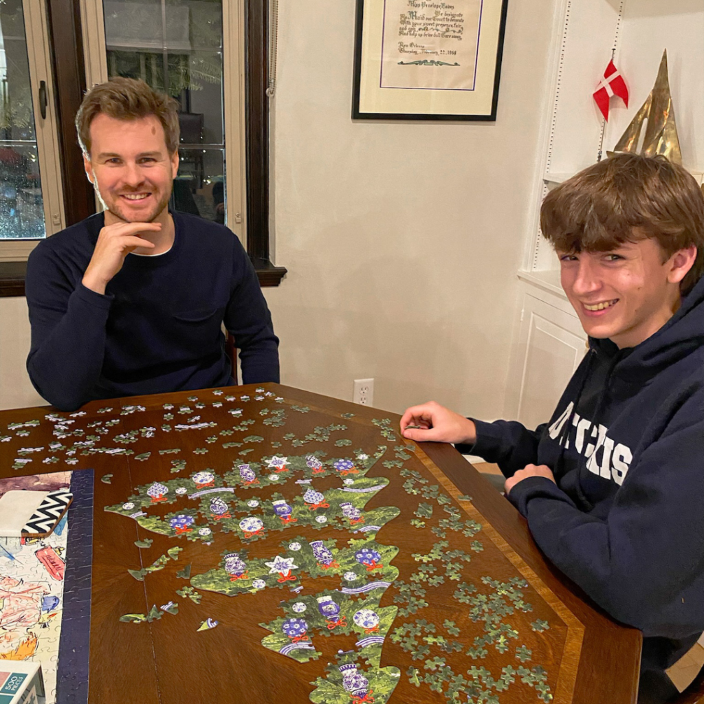 William and an uncle putting together a puzzle
