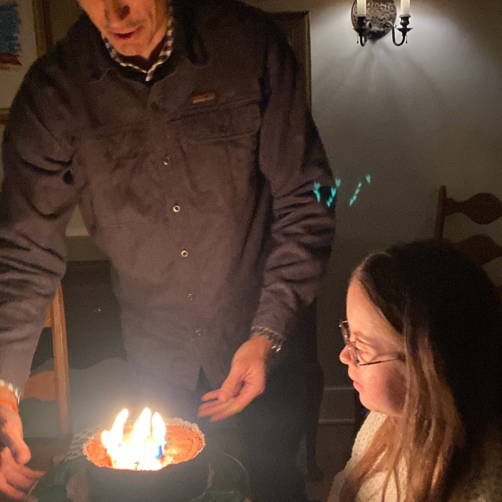 Peter giving Penny her birthday cake
