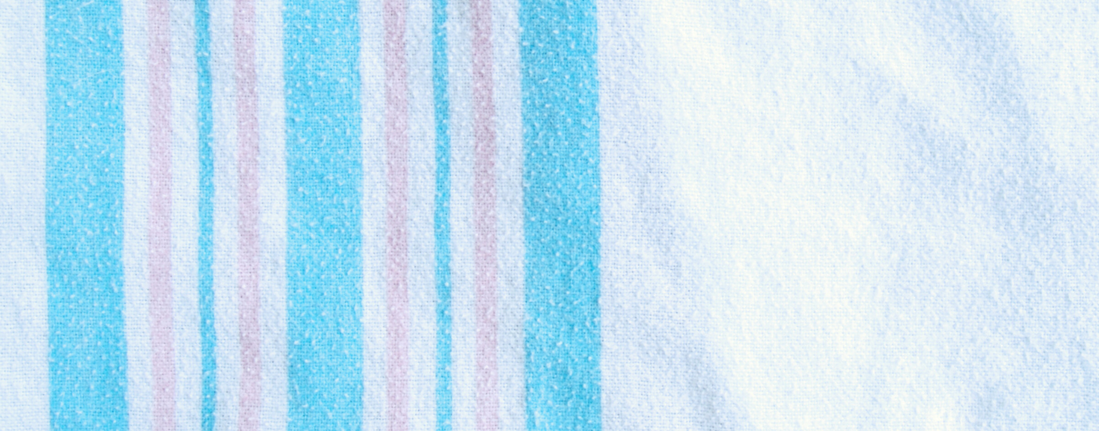 the traditional blue and pink striped blanket that babies are wrapped in in the hospital
