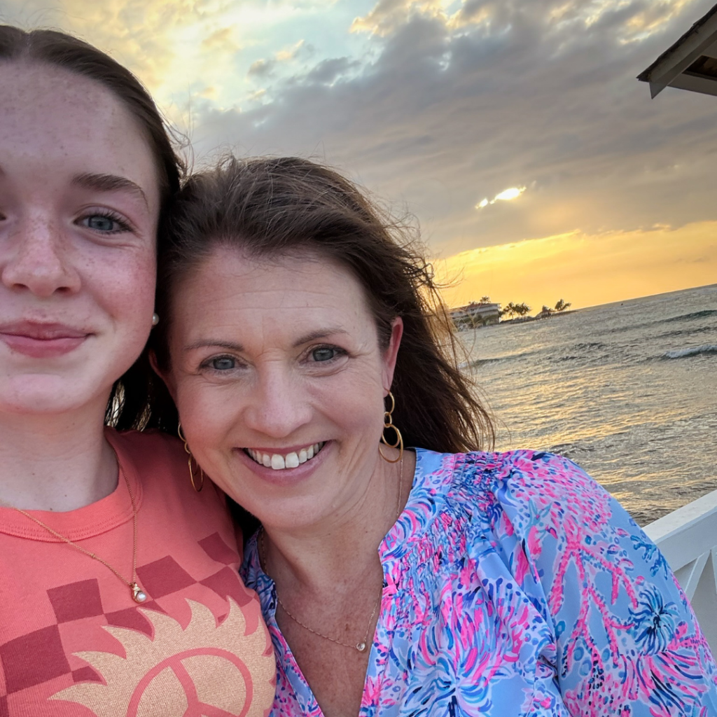 Marilee and Amy Julia take a selfie on the beach at sunset