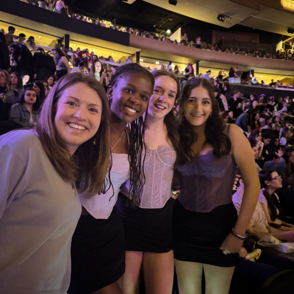 Amy Julia and three teenage girls at a concert