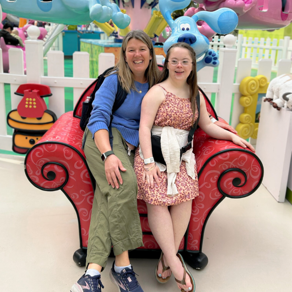 photo of Penny and a friend sitting in a Blue's Clues red chair