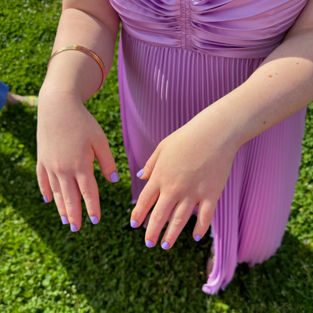 photo of Penny's nails painted to match her purple dress