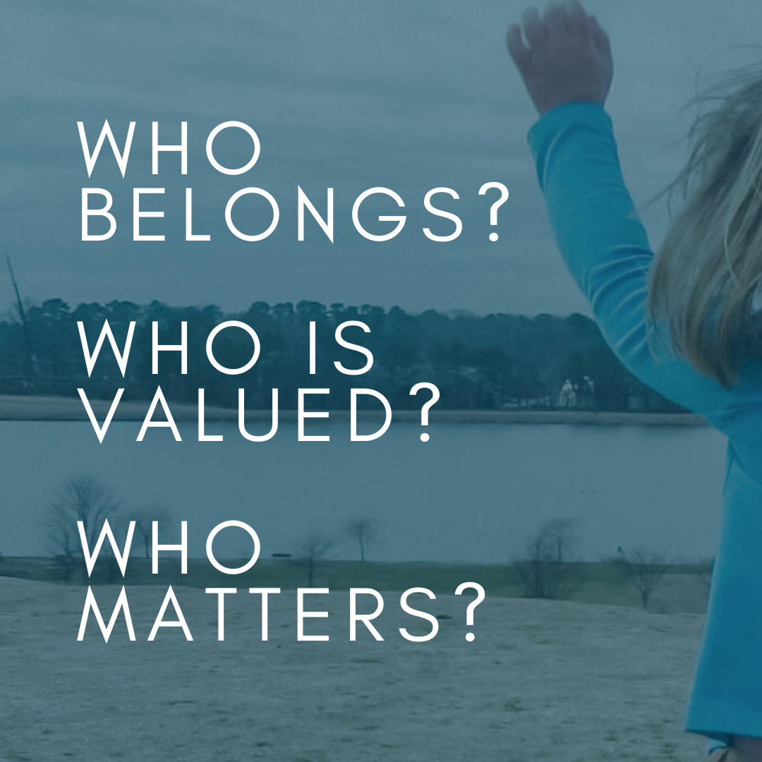 a blue-tinted photo of a young child waving towards a distant shore with a lake in front of her. Text overlay says: Who belongs? Who is valued? Who matters?