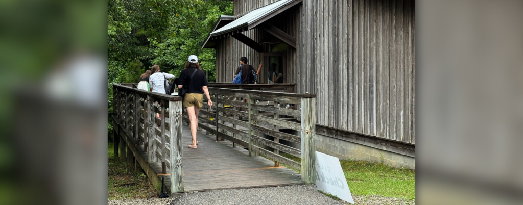 a camp building designed with universal design; a ramp leads to the front door, which has an accessible entrance