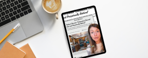 desk with a laptop and cup of coffee and an ipad. On the ipad screen is an image. The image shows a combination of a news article and Amy Julia addressing the camera in a split-screen format. The upper part displays a New York Times headline titled "Today's Parents: 'Exhausted, Burned Out and Perpetually Behind'" with a brief summary: "The surgeon general is warning about parents' stress, a sign that intensive parenting may have become too intense for parents.”