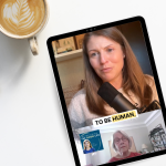 An image featuring a tablet placed on a white desk alongside a laptop, a cup of coffee with latte art, a pencil, and notebooks. The tablet displays a video call, showing two women engaging in a discussion. The top half of the screen shows Amy Julia speaking into a microphone, with the text overlay 'TO BE HUMAN,' while the bottom half features Rosemarie in a smaller window with a background of bookshelves.