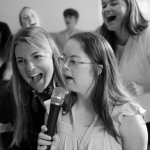 Penny singing karoke with friends at Hope Heals Camp.
