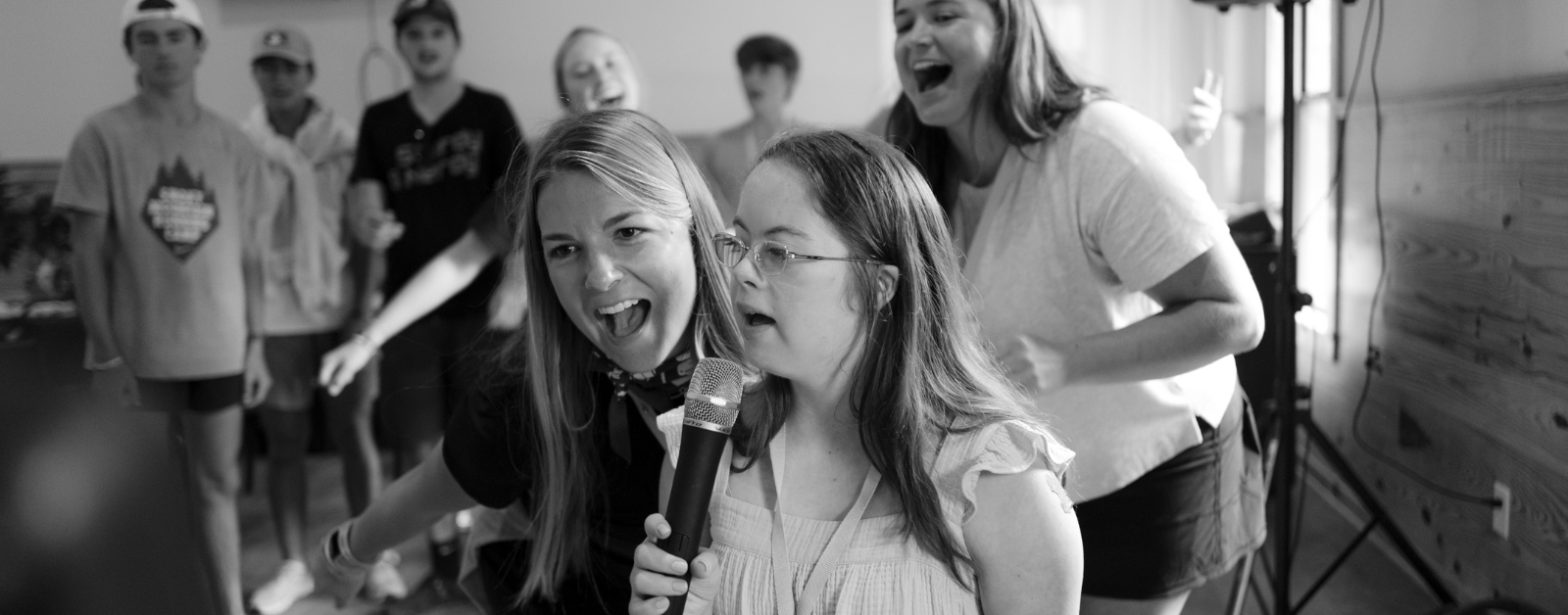 Penny singing karoke with friends at Hope Heals Camp.