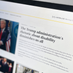 A close-up photograph of a laptop screen displaying an online news article. The article's headline reads, "The Trump administration's rhetoric about disability diminishes us all." The page features an image of former U.S. President Donald Trump speaking at a podium, with other smaller images below.