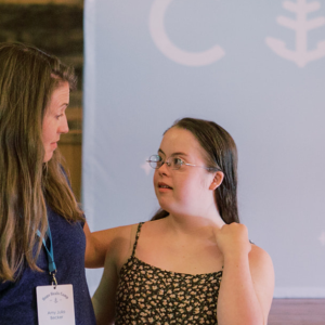 photo of Amy Julia looking at Penny as they do a presentation together