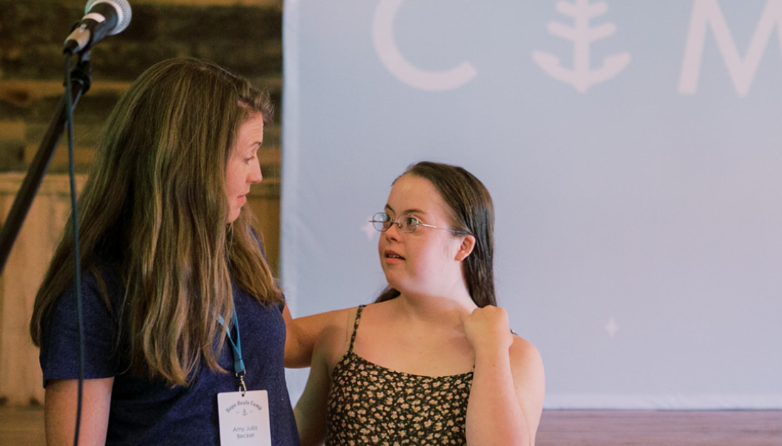 photo of Amy Julia looking at Penny as they do a presentation together