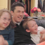 photo from 2013 of Peter and the kids piled together and laughing on the couch