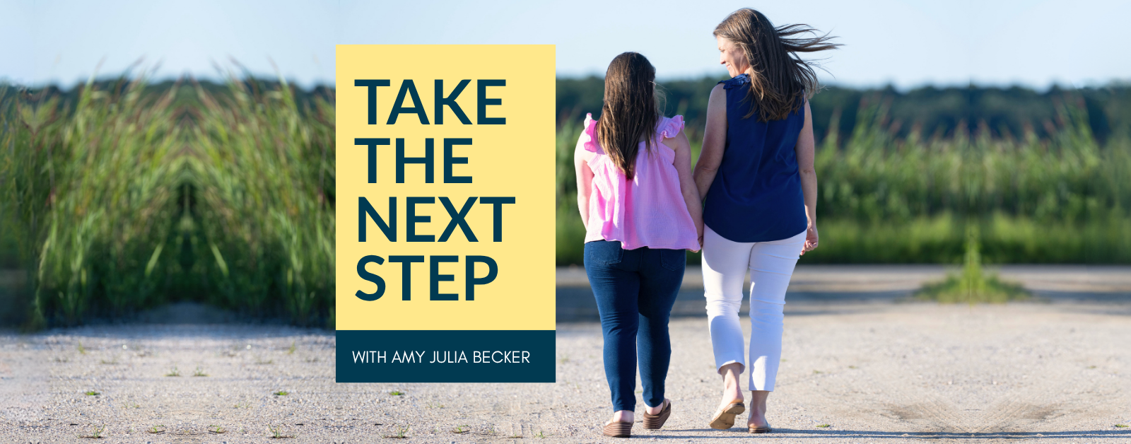 Podcast cover for Take the Next Step with Amy Julia Becker. On the right side, a woman and a teenage girl walk hand in hand down a sunlit gravel path, both viewed from behind. The woman wears a navy top and white pants, and the girl wears a pink ruffled top and jeans. On the left side, a yellow box contains the podcast title in bold navy text. Below it, a navy strip reads “With Amy Julia Becker” in white font. The background is clear and bright, suggesting a warm, peaceful day.