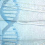 Stack of light blue denim jeans overlaid with a transparent image of DNA double helix strands.
