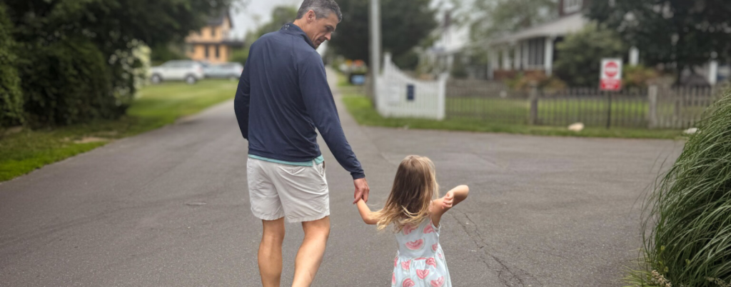 Peter walking with our niece down a road