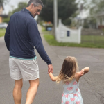 Peter walking with our niece down a road